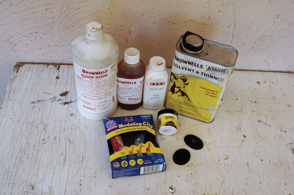 Supplies for producing grip caps included Brownells Acraglas and hardener, baby powder, thinner, modeling clay, black dye and grip caps to copy.